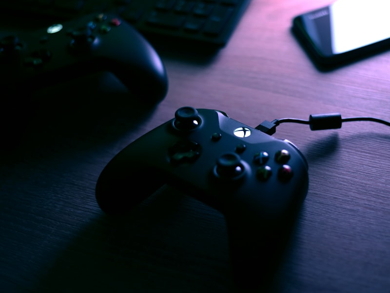 Controller resting on a stack of games